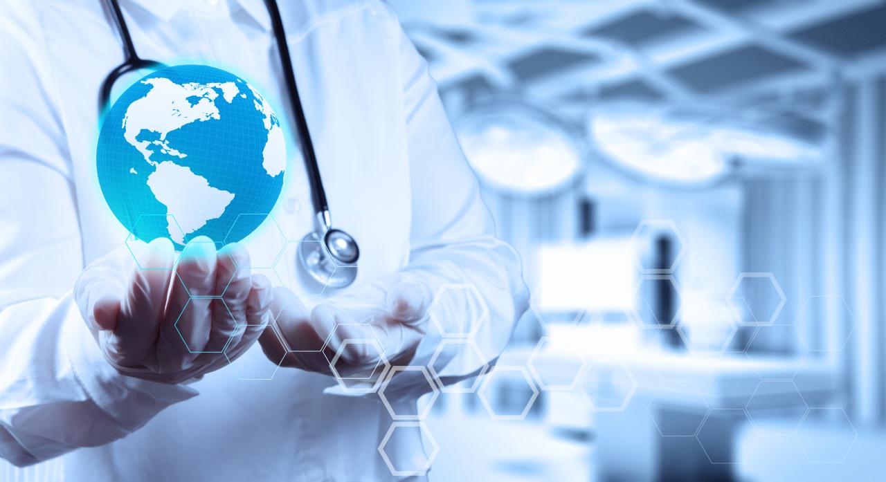 Medical Doctor holding a world globe in her hands as medical network concept